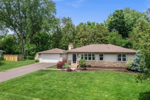 Nestled on an incredible .40 acre lot with tree lined backyard, meticulous landscaping, and outstanding outdoor spaces.