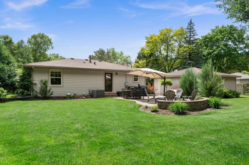 Enjoy easy indoor-outdoor living with two main-level walkouts leading to inviting backyard patios.