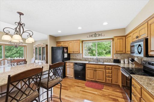 Hardwood floors, granite tops on the counter and peninsula