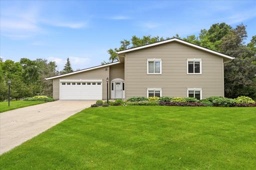 Welcome to 1484 Crest Drive, Chaska! Anderson windows throughout the home AND Seamless steel siding on the entire exterior.
