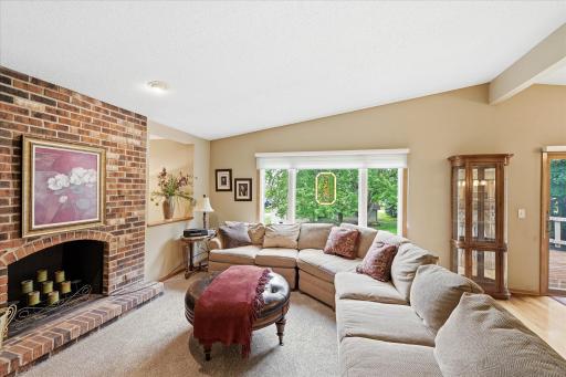 Another photo of the living room with large picture window in the background.