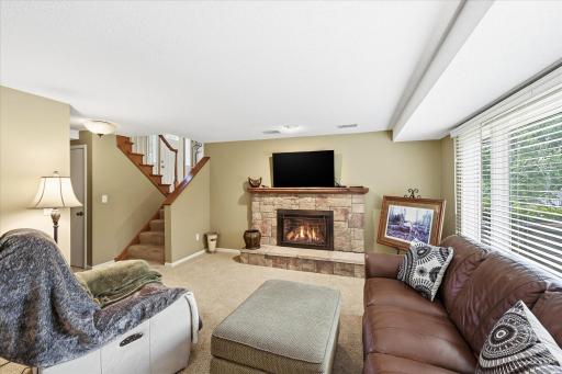 Cozy up to the fireplace in the lower level family room.