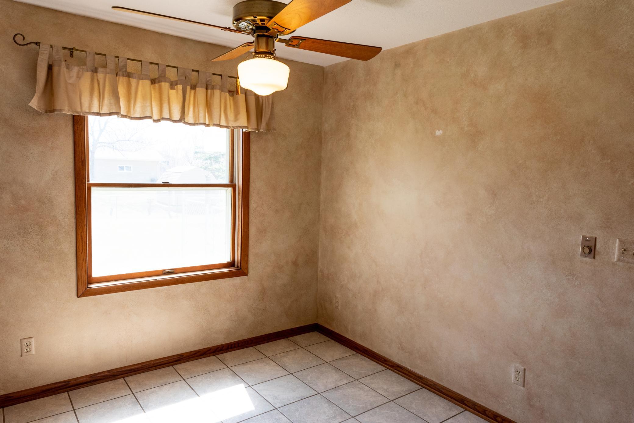 Eat in kitchen looks out over spacious back yard.