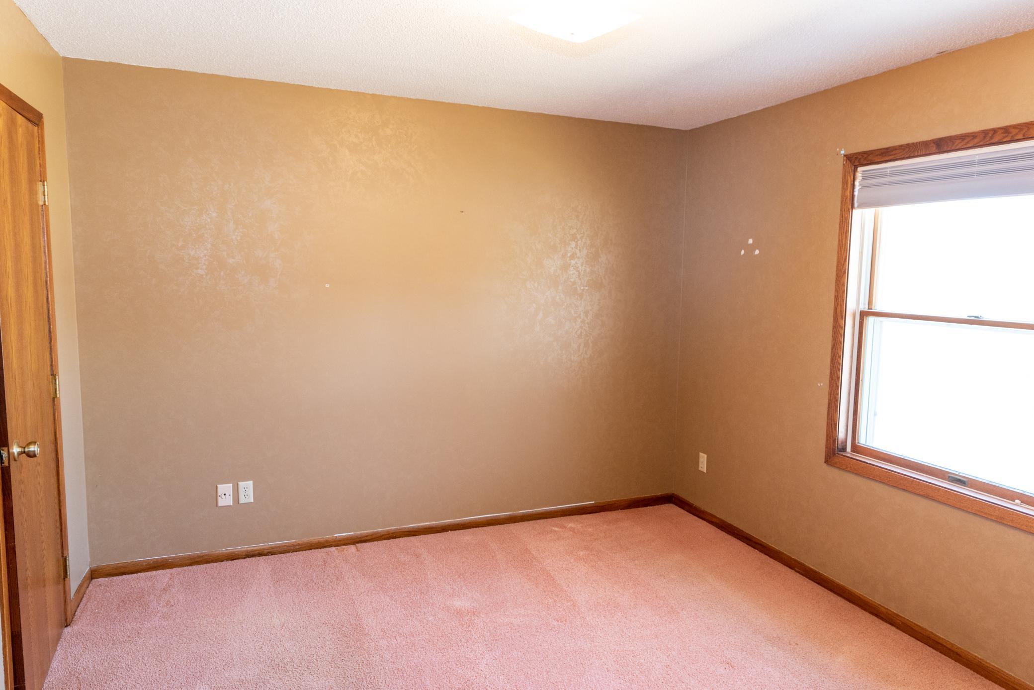 Main floor bedroom boasts a cedar lined walk-in closet.