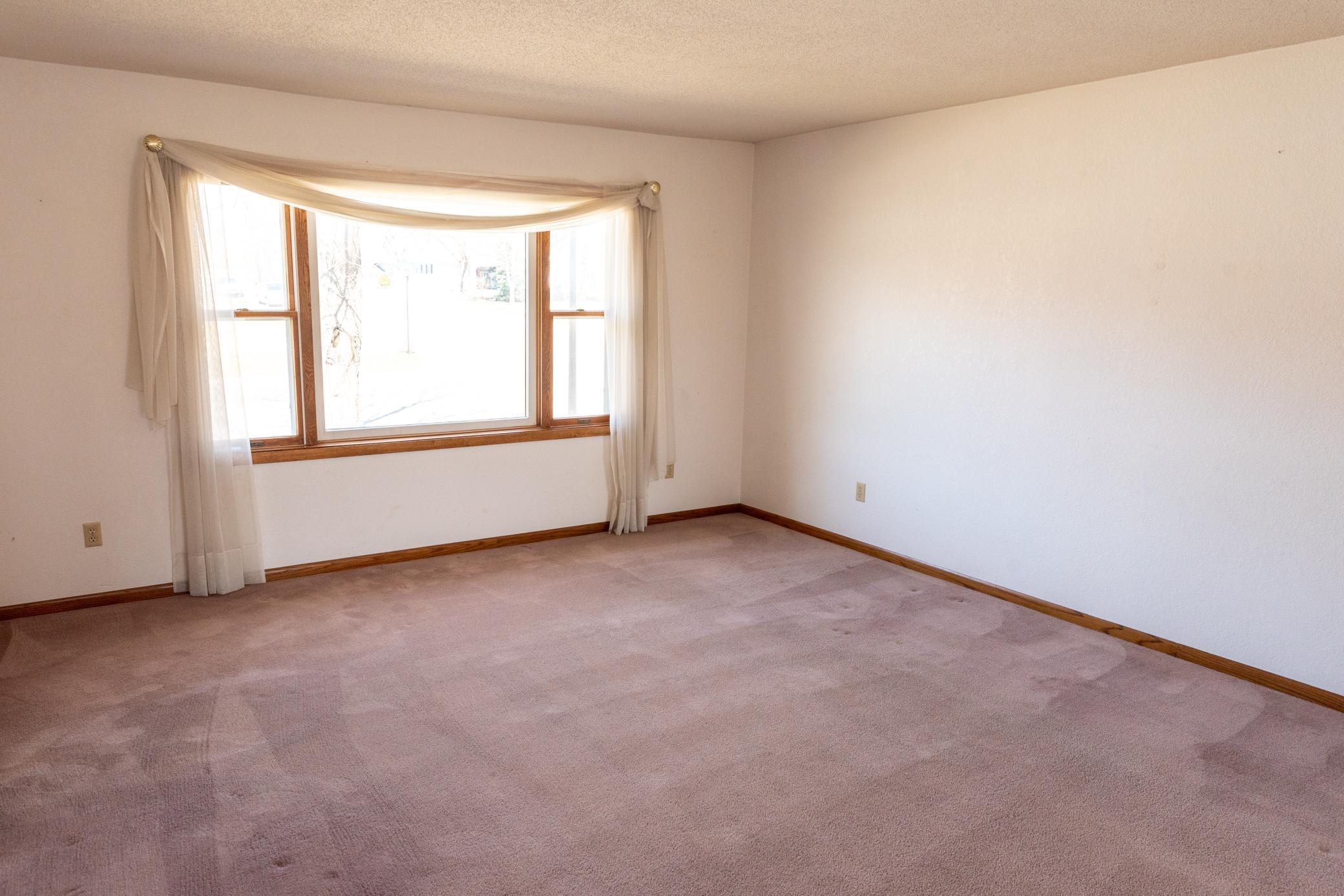 The living room is very spacious and bright with large picture window. Great potential for future French or sliding door to a deck!