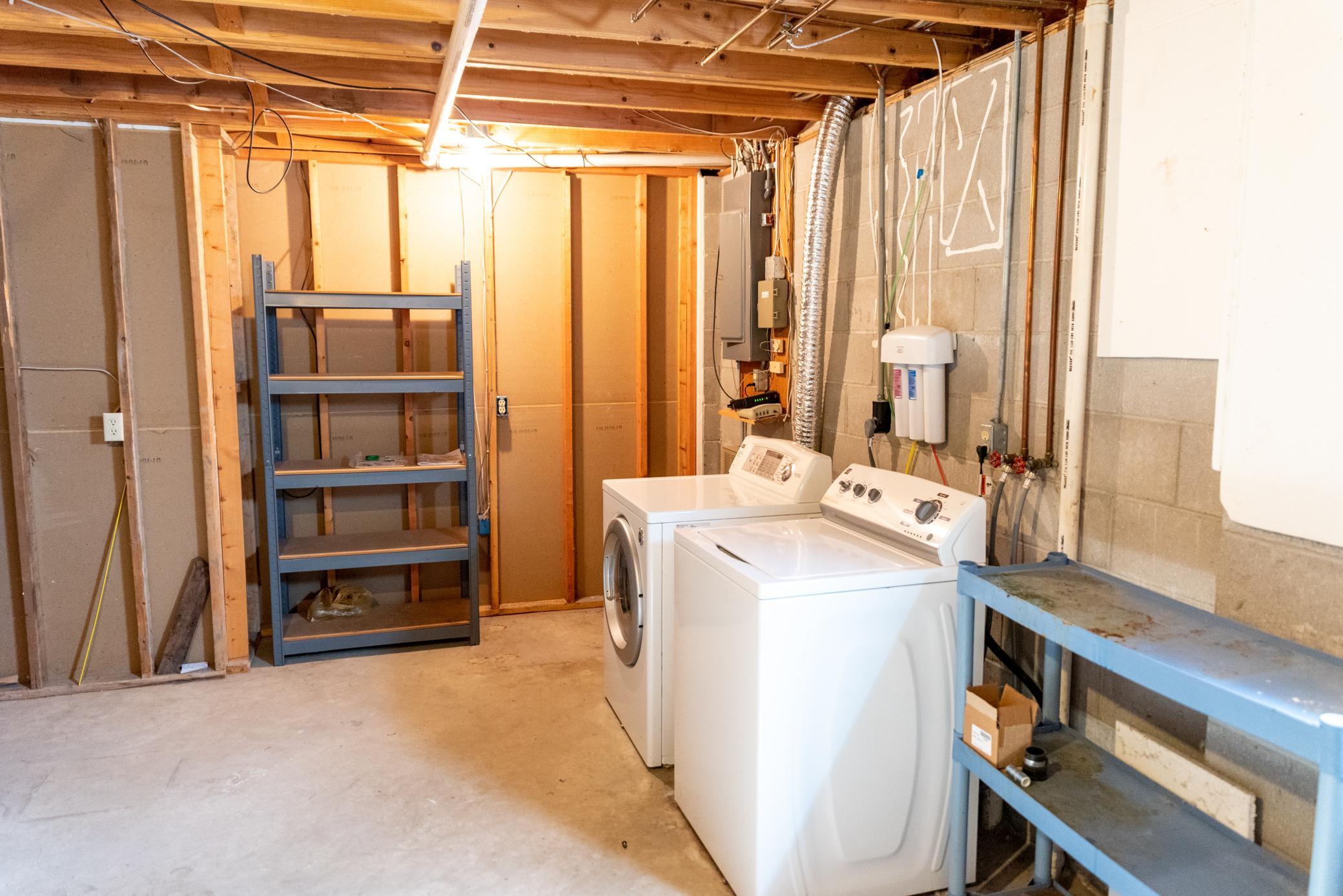 Unfinished today, this laundry & mechanical room offers lots of storage space with option for large closet to accomodate future bedroom on end wall..