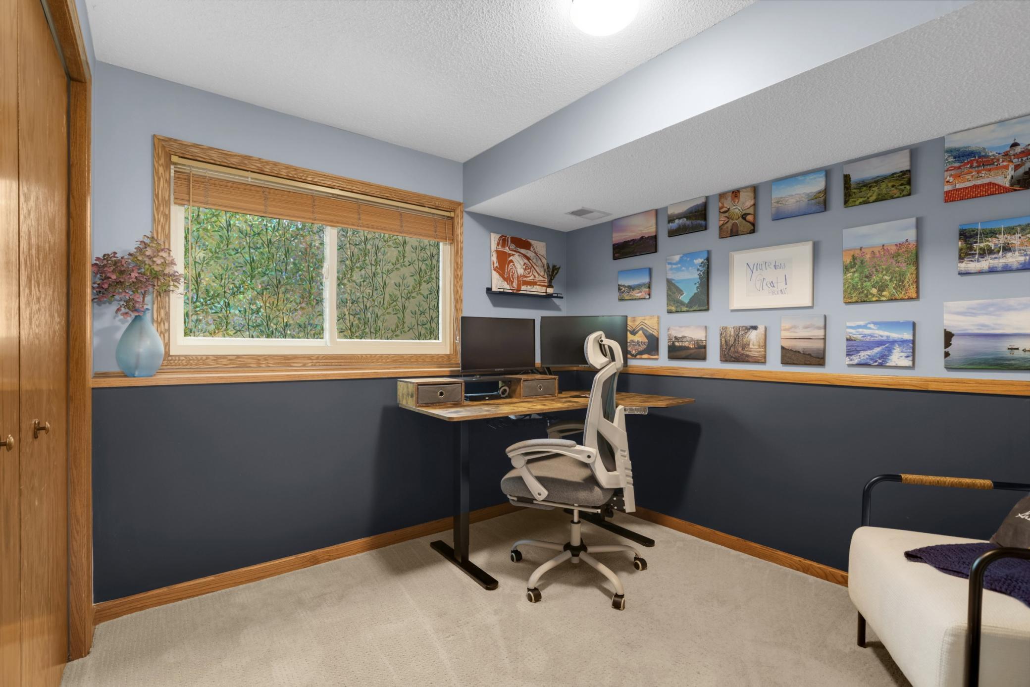 Currently used as a stylish home office, this versatile third bedroom offers the perfect blend of comfort & functionality. The space features soft neutral carpeting, modern two-tone paint, & large daylight windows that bring in tons of natural light