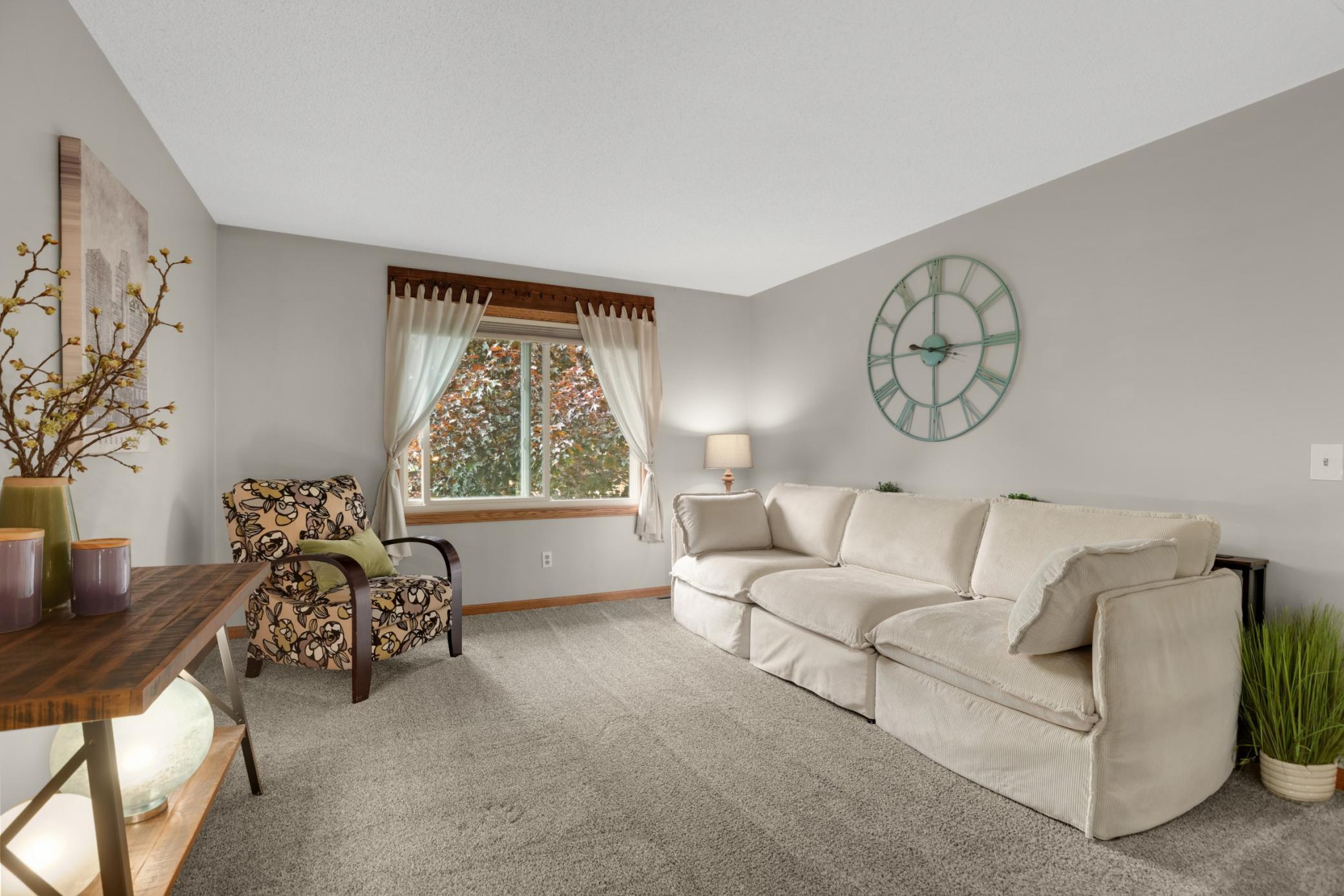 This inviting loft-style living space offers the perfect blend of comfort and functionality. Overlooking the main living area, dining kitchen below, the open upper-level design creates a spacious and airy feel while maintaining a cozy atmosphere.