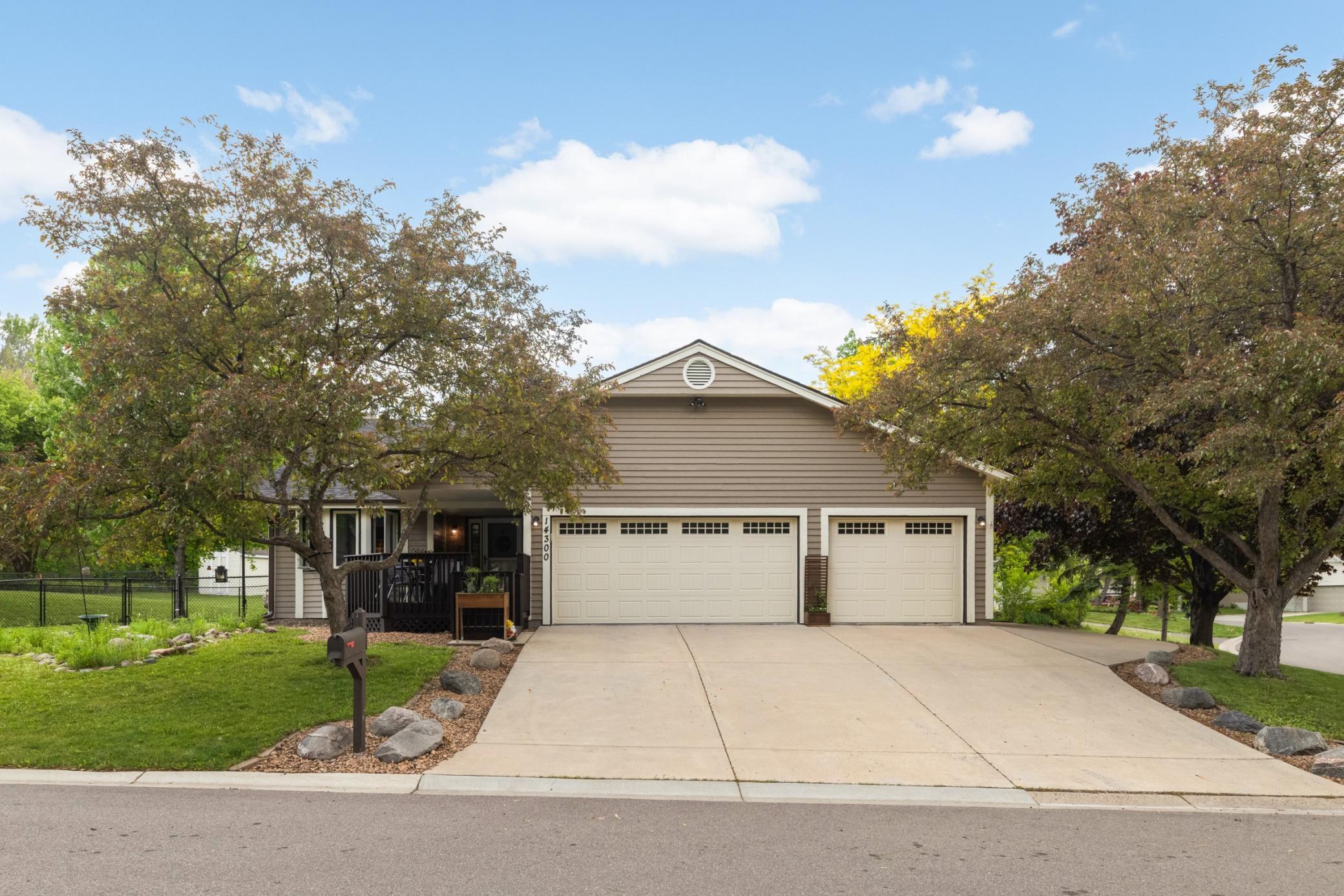 Beautiful crab apple trees in the front and side yard, concrete drive, front porch with a gate to contain dogs or kids on a corner lot with a fenced in yard + a SHED on the side for storage. What more do you need??