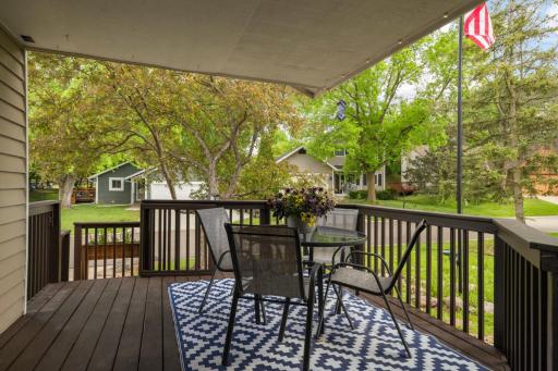 This inviting covered front porch offers the perfect blend of comfort and curb appeal. . Mature trees provide natural shade and privacy, while the covered ceiling allows for enjoyment rain or shine.