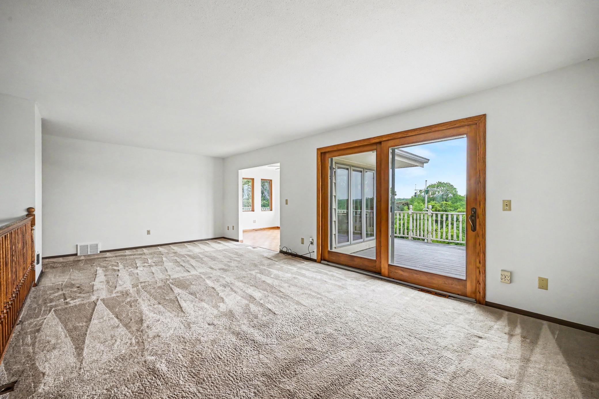 Spacious Living Room with patio door to oversized deck