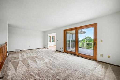Spacious Living Room with patio door to oversized deck