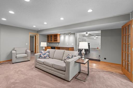Convenient wet bar adds the perfect touch for entertaining, making lower-level living ideal for gatherings, game nights, and hosting guests.