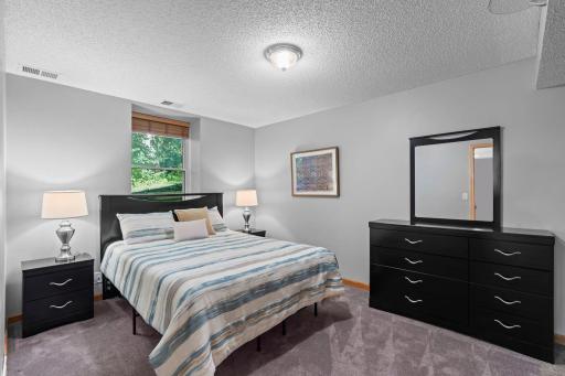 Lower-level bedroom 6 off family room.