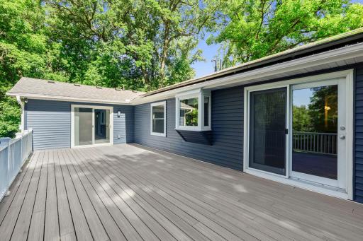 Large maintenance-free deck extends your living space outdoors and features direct access to the primary bedroom, making it easy to enjoy the beauty of the surrounding nature.