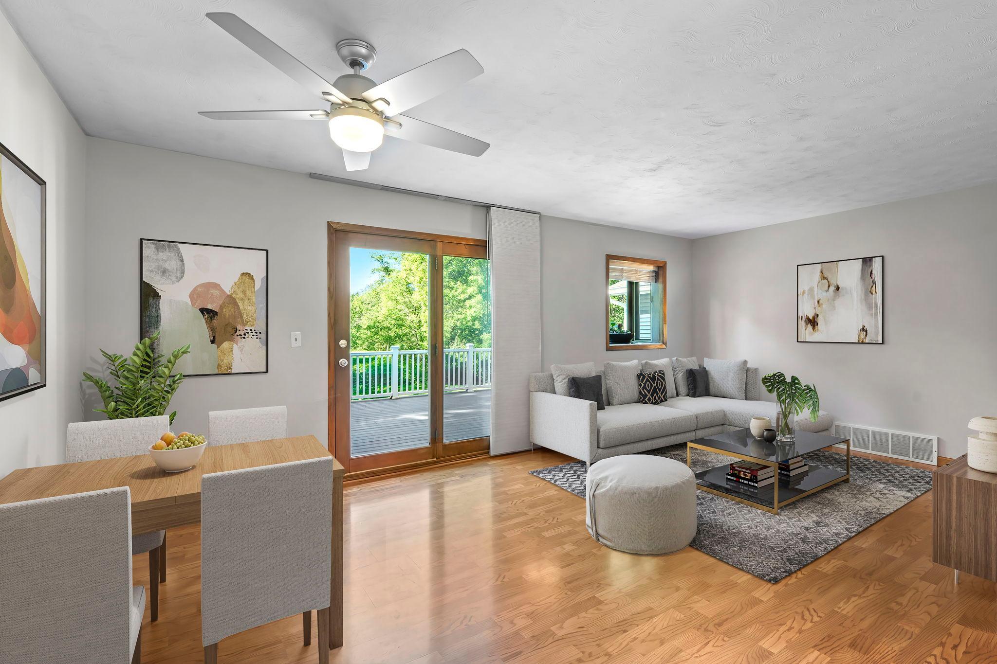 Living/dinning area with walkout to large deck (Virtually staged)