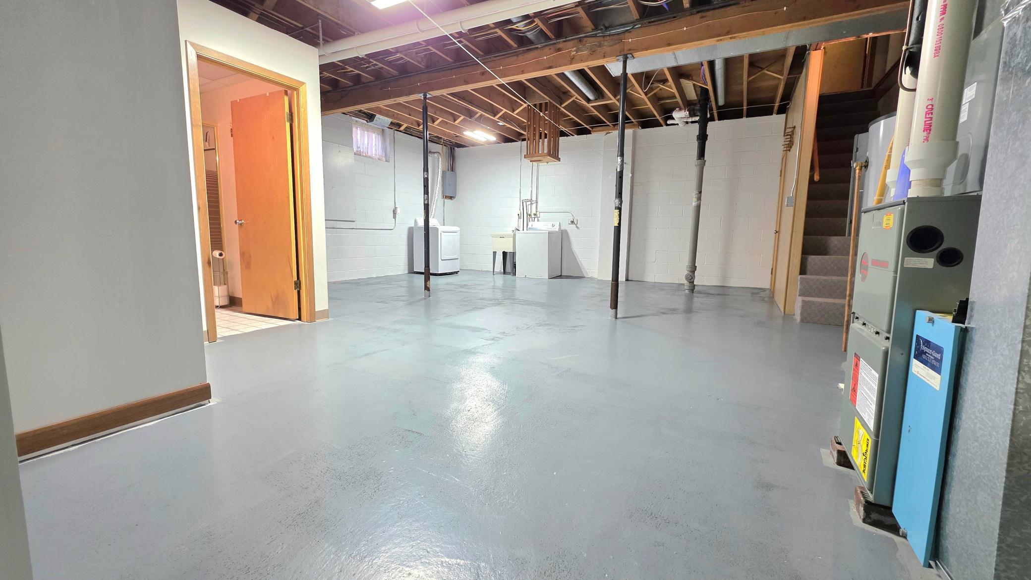 family room & laundry lover level, newer electric water heater, owned softer