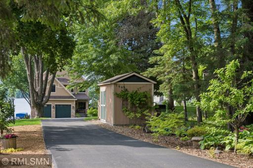 View of the home/driveway/shed/partial flower gardens/vegetable garden to the left from the front of the property near Lori Rd