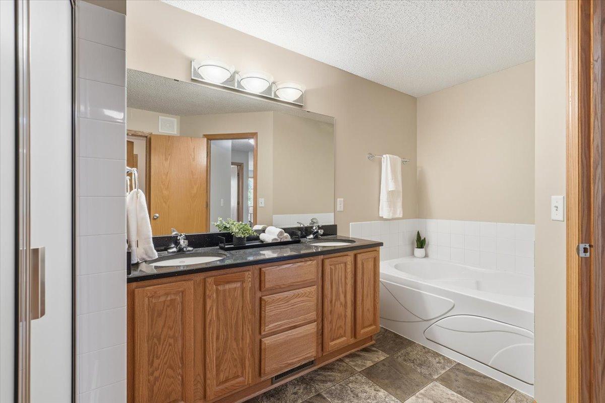 Dual vanity and separate jetted tub