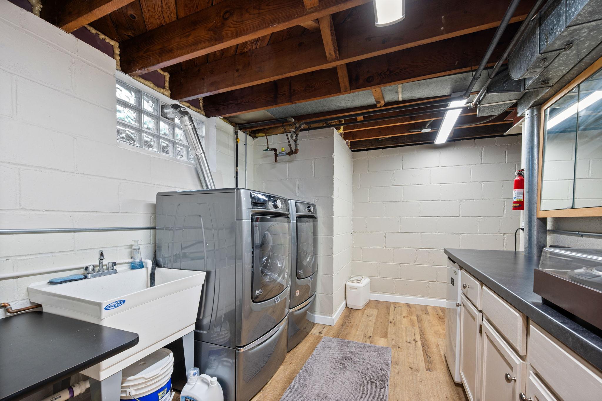 Neat, Clean Laundry Room with Additional Storage