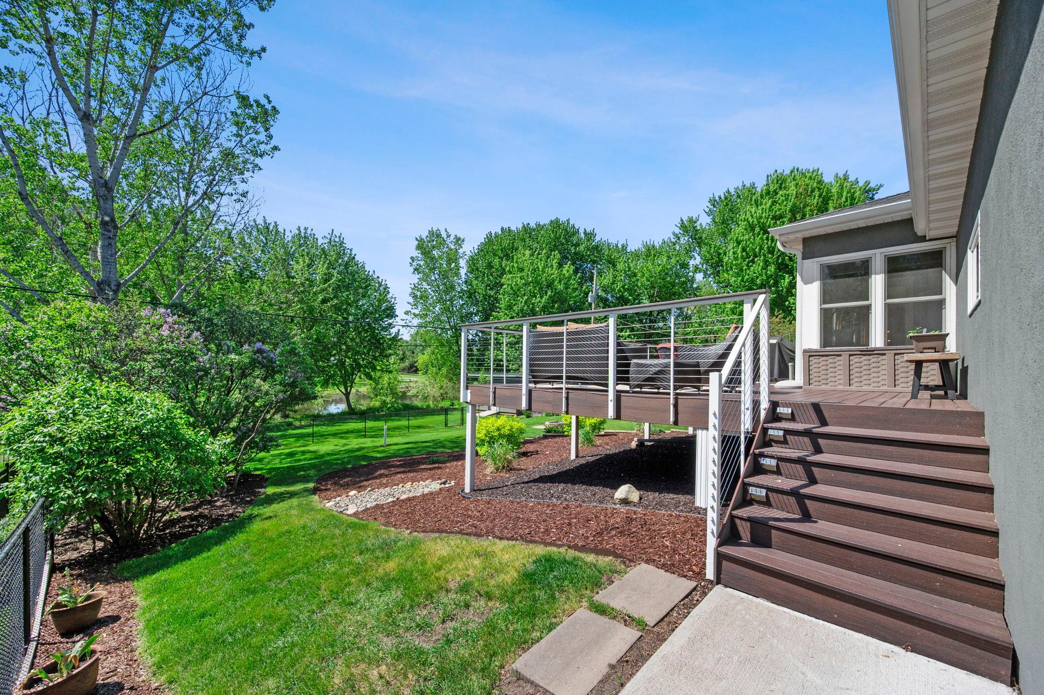 Deck walks down to backyard