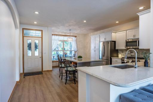 Walk in to this bright, open concept home with eat in kitchen and huge center island!
