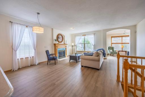 Open living room with beautiful, teal tiled gas fireplace!