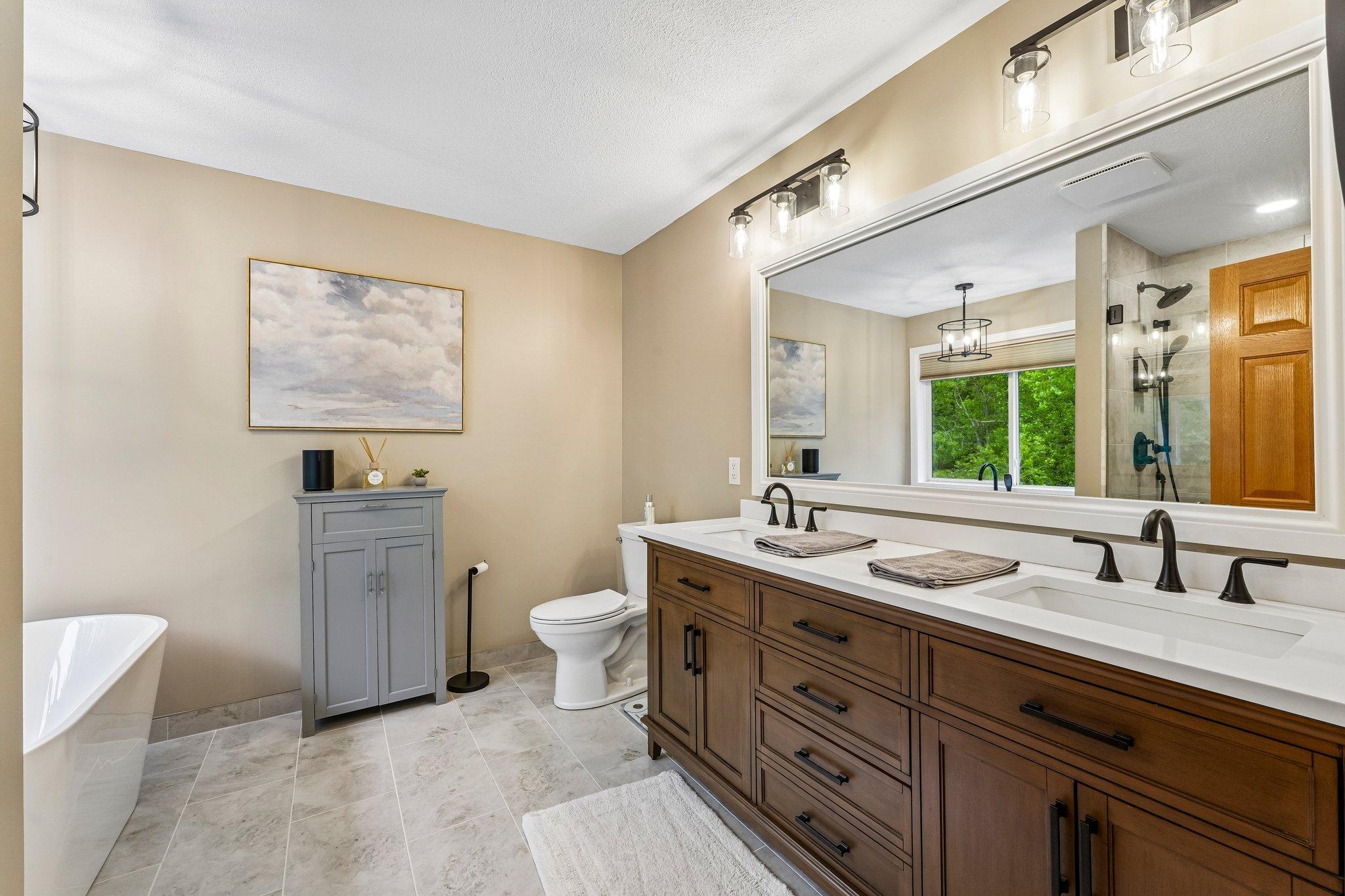 Primary private bath with double sinks, soaking tub