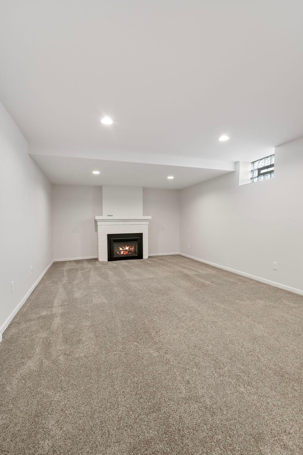 Lower level family room with gas fireplace.