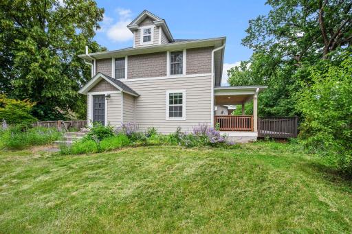 Side of home, side door leads to living room.