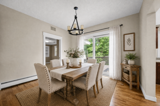 Dining room with sliding glass door that opens up to deck