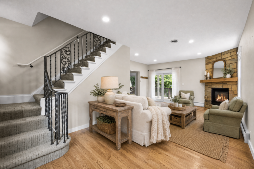Wood floors and gas fireplace in living room