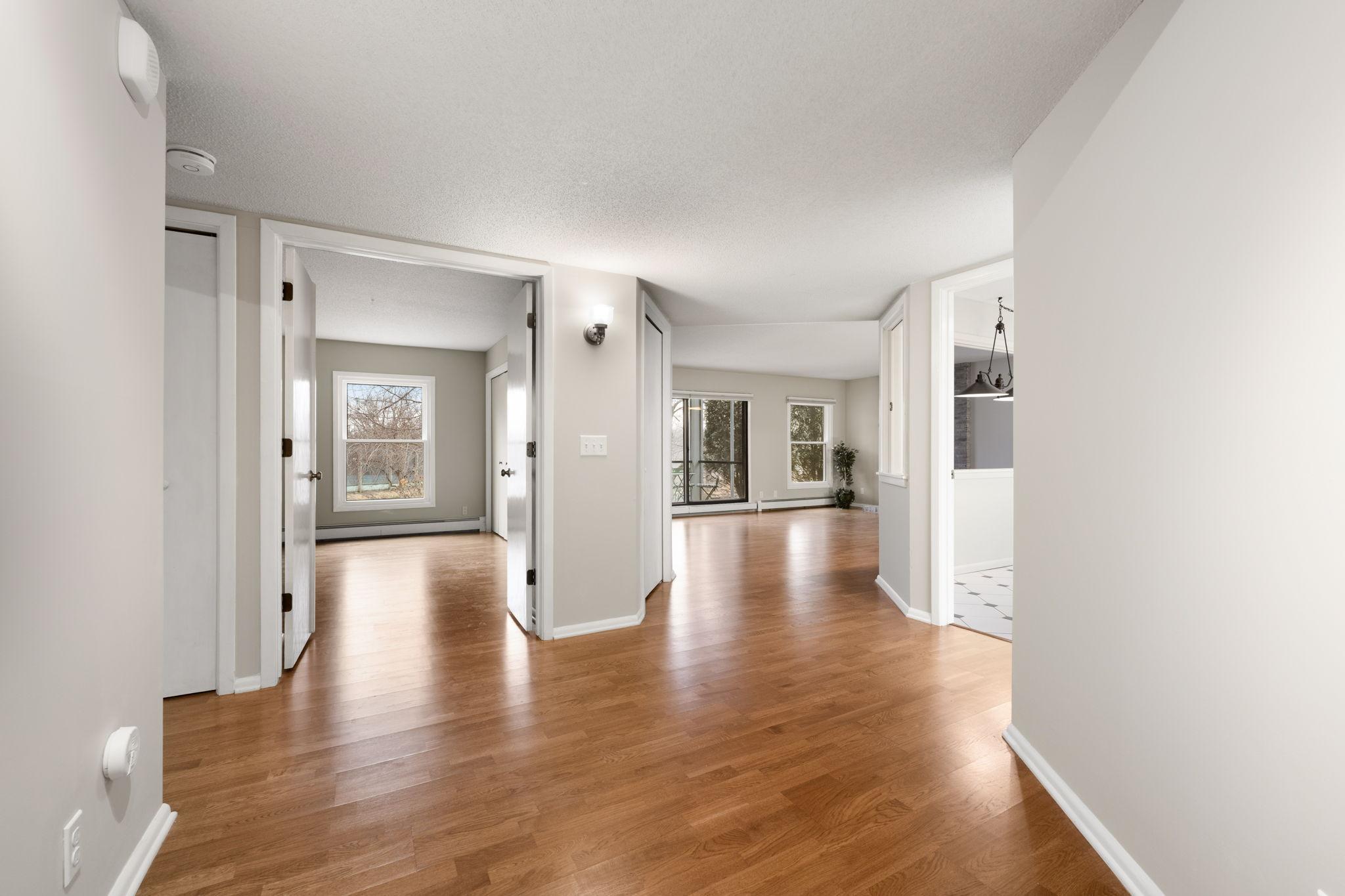 Open-concept layout offering seamless connection between the entry, living room, and adjacent rooms.