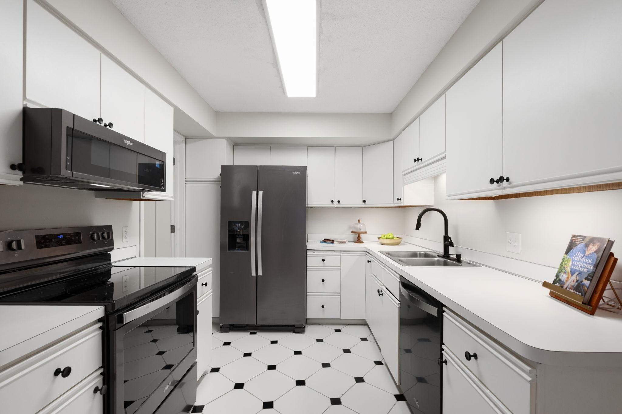 Clean, functional kitchen with abundant cabinet storage, ample counter space, and updated appliances.