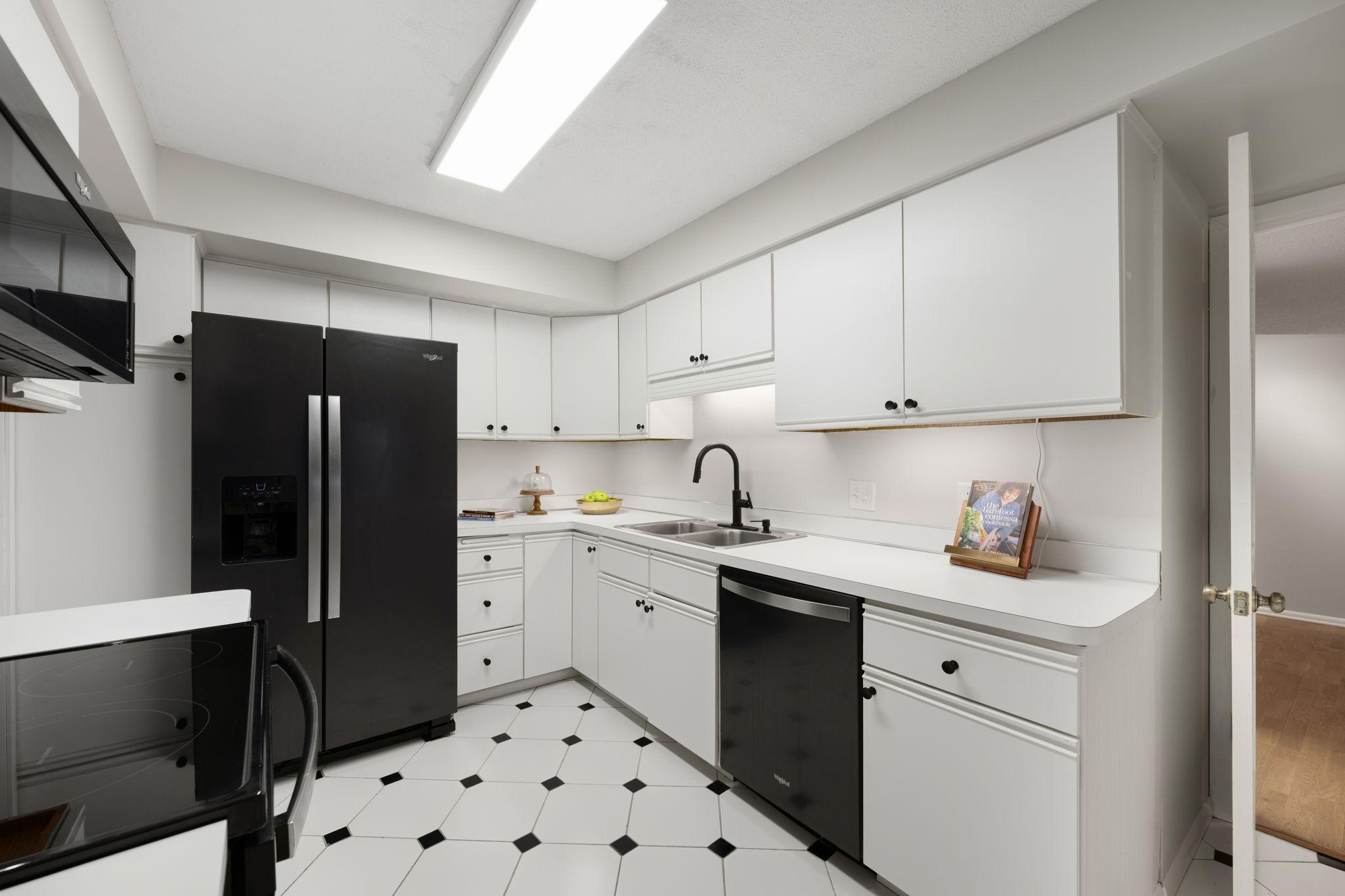 Kitchen showcasing abundant cabinetry and efficient layout.