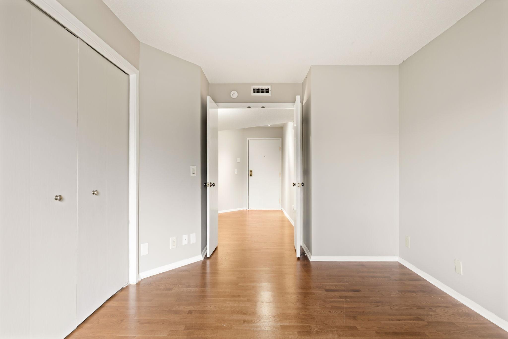 Second bedroom view showing direct connection to the hall and nearby living spaces.