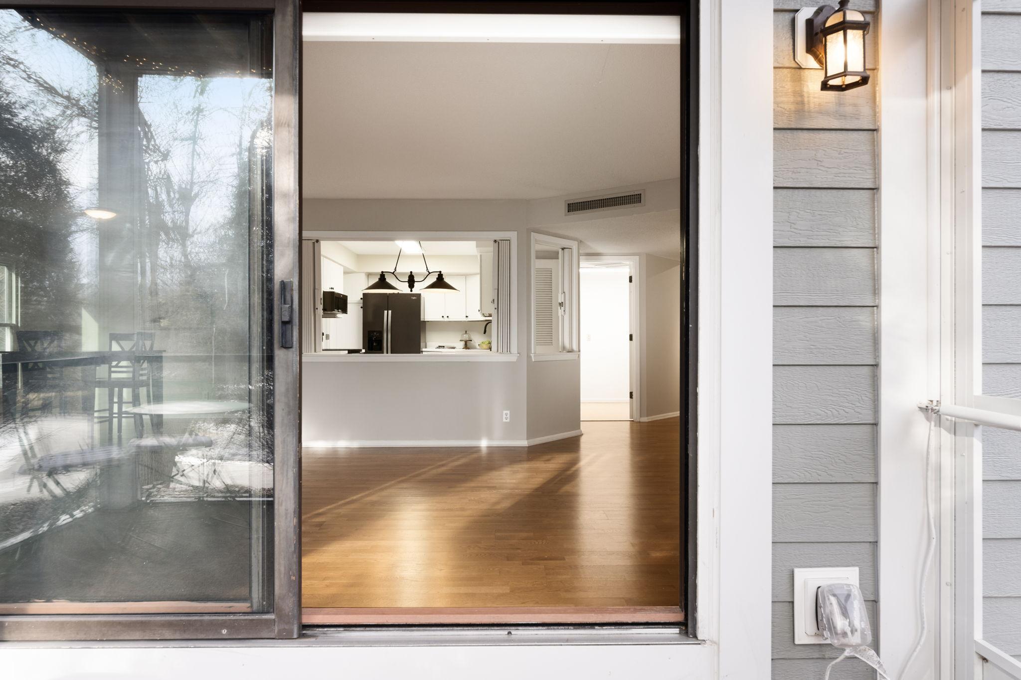View from the screened porch back into the main living space and kitchen.