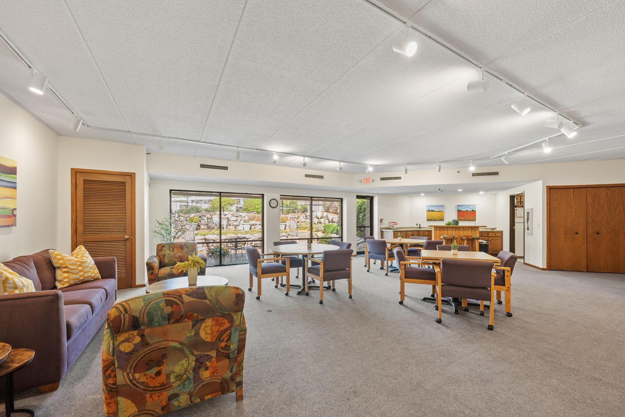 Spacious community room with seating areas for gatherings and events.
