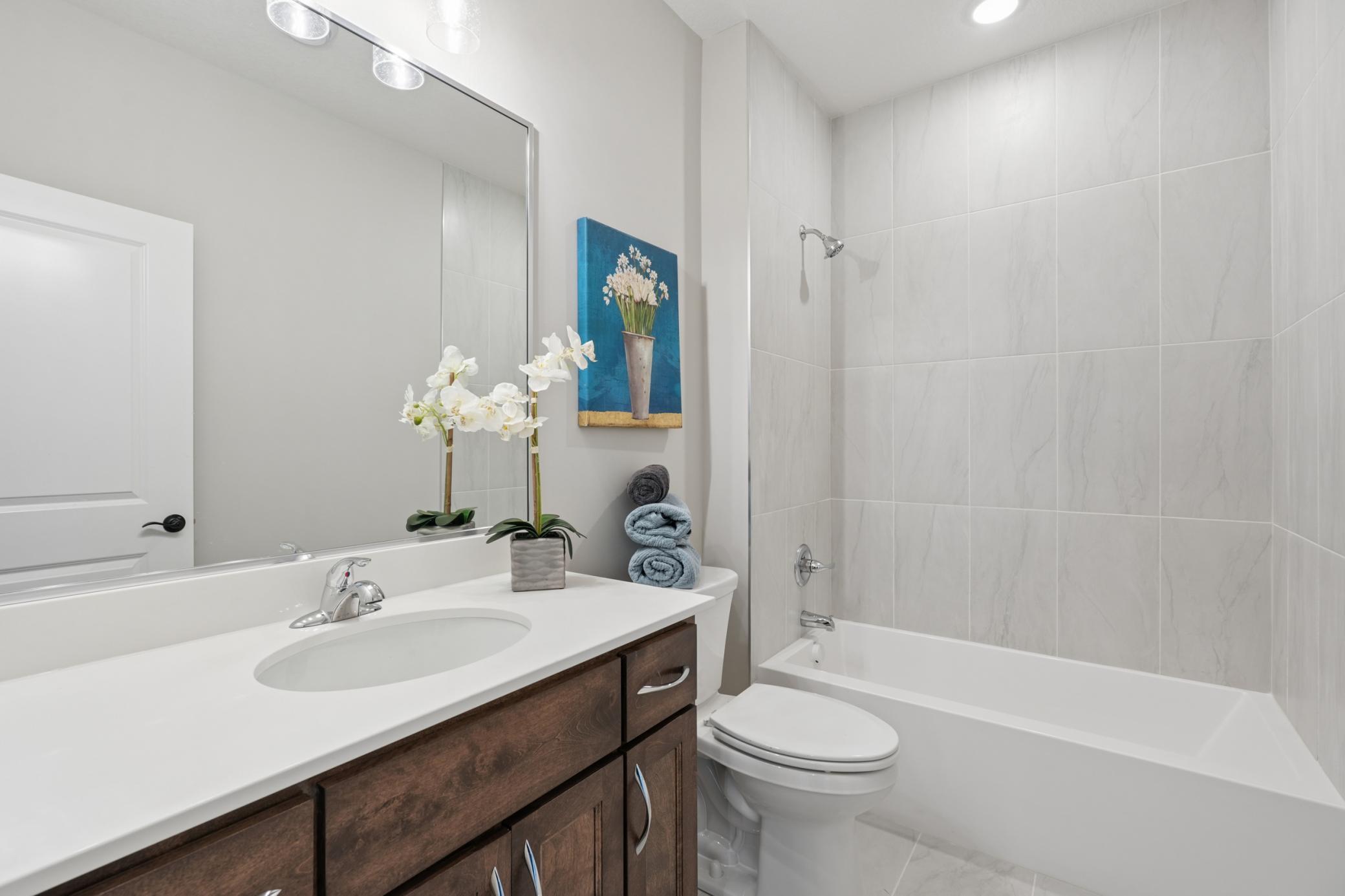 Main floor Bathroom again with Floor to Ceiling real tile finishes