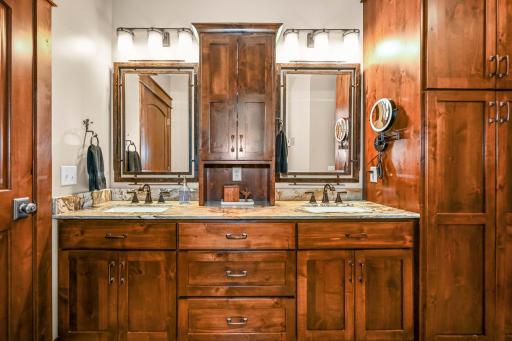 Custom double vanity with beautiful wood craftsmanship throughout
