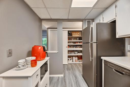 Kitchen leads to double sided Pantry and Storage Closet