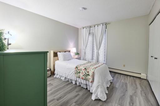 Freshly Painted light and bright primary bedroom