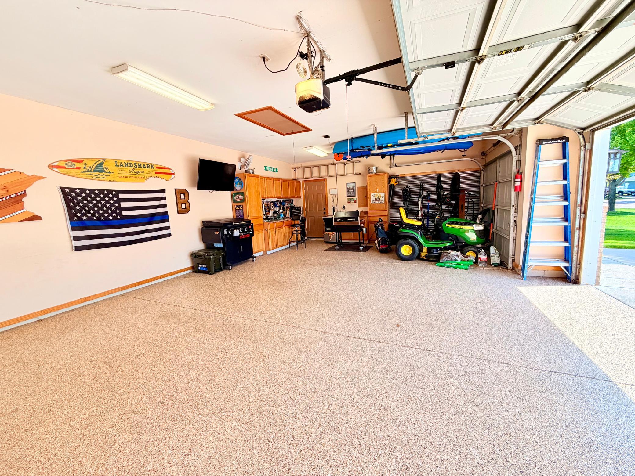 Superior 3-car garage with epoxy flooring