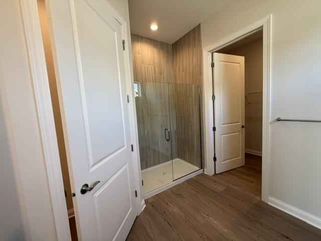 Elegant tilework and modern fixtures elevate the walk-in shower, offering a sleek, spa-inspired design that feels both timeless and on-trend.