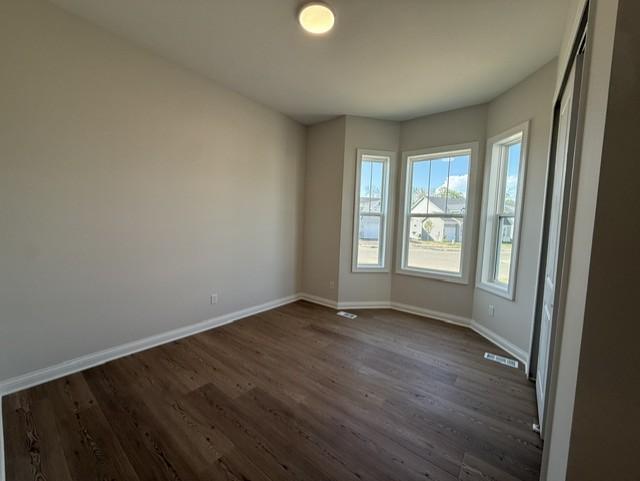 Flexible in its use, this guest bedroom can easily serve as a cozy retreat, home office, or additional sleeping space as needed.