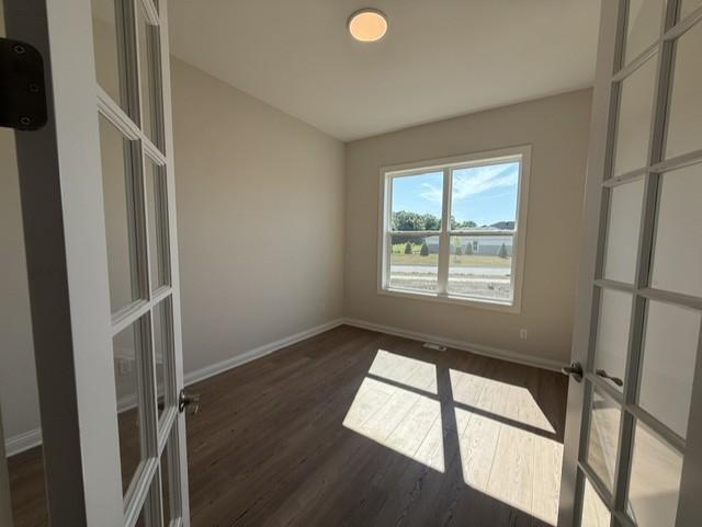 Bright and functional flex space perfect for working from home. Features a large window, ample room for a desk and shelving, and quiet privacy away from main living areas.