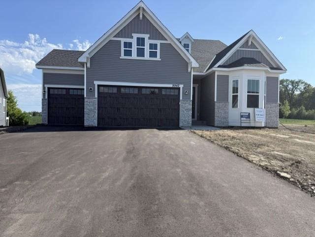 Striking curb appeal with clean lines and modern architectural design. The well-manicured landscaping complements the sleek exterior finishes, creating a welcoming and polished first impression.