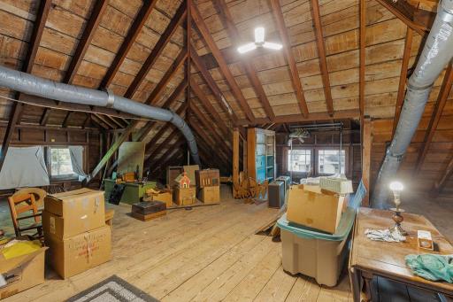 Walk up attic offers potential for additional finished space, abundant storage and houses air handler for CA
