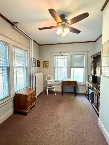 Off the entry, this space lends itself to multiple uses-office, main floor BR- you decide.