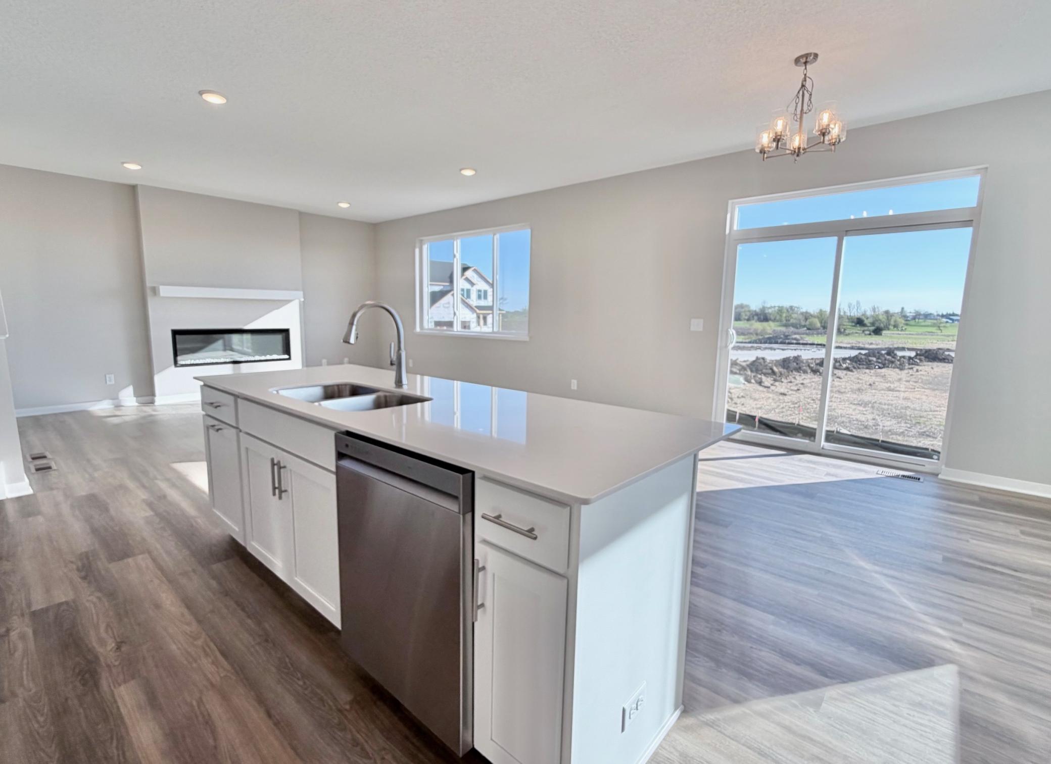 PHOTO OF A DIFFERENT HOME WITH SIMILAR PLAN. FINISHES MAY VARY.
